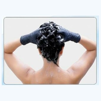 Massaging the lather through the hair
