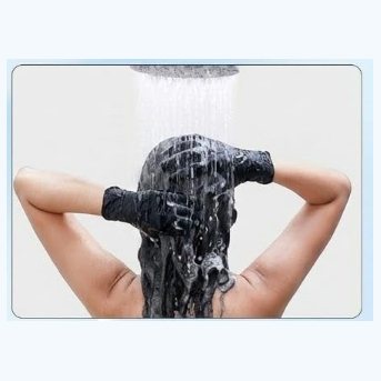 Rinsing the hair under a shower